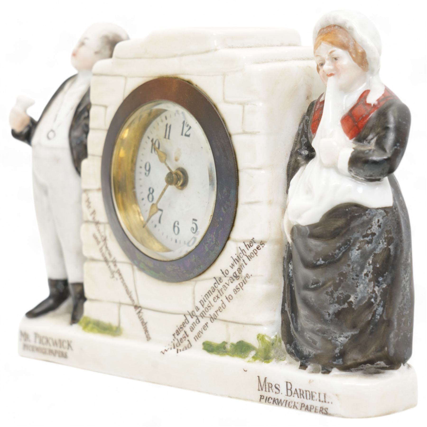 Late 19th century -  'The Pickwick Papers' novelty mantle clock, with flanking figures 'Mr Pickwick' and 'Mrs Bardell', 30 hour spring driven timepiece movement with a pin pallet escapement, wound and set from the rear, H11cm