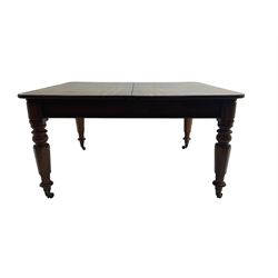 Late 19th century extending mahogany dining table, square top with banded frieze rail, raised on turned octagonal supports with  brass cups and castors, with two additional leaves