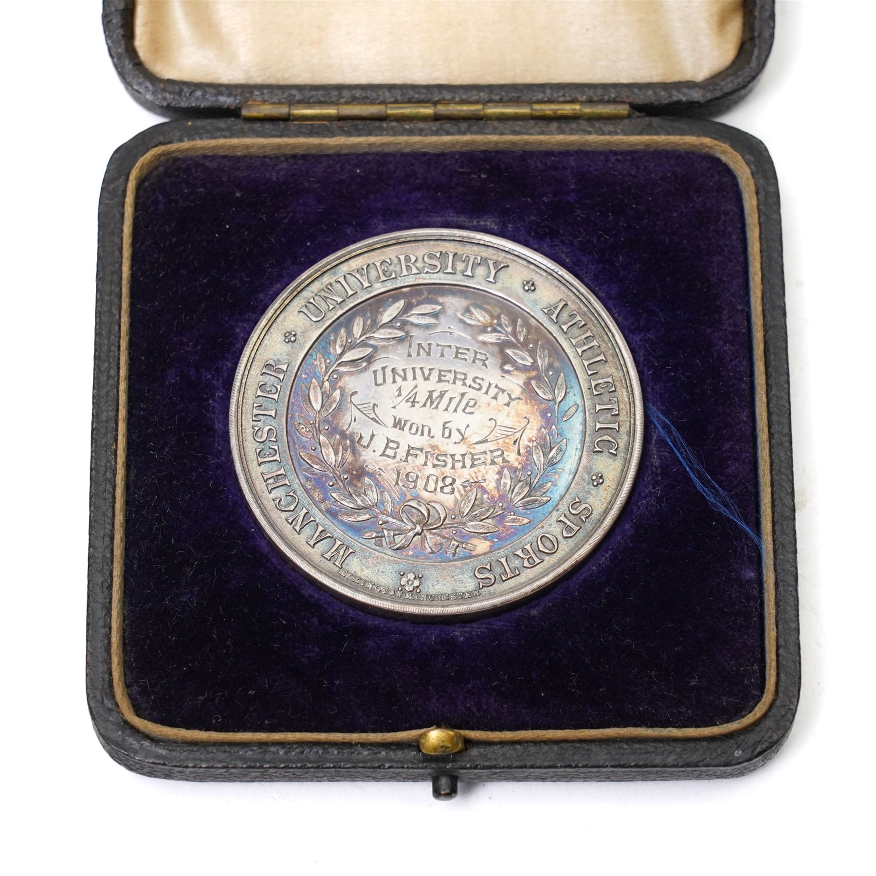 Group of early 20th century sporting medallions, fobs and badges, including two silver Inter Varsity 1/4 mile cased medallions, two silver fobs, white metal and enamel cricket fob etc, one awarded to John Barugh Fisher (1888-1924) born in Amotherby, studied at Leeds University and became doctor in 1911, later Captain John Barugh Fisher R.A.M.C., together with four early 20th century nurses badges, two for General Infirmary Leeds, three inscribed B.P. Simpson, housed in an inlaid work box