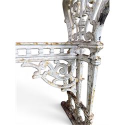 Victorian cast iron garden table, rectangular slate top raised on pierced scrolling foliate end supports with urn and column designs, united by a spindle support stretcher with scrolling acanthus spandrels, stamped 'Registered Design' with indistinct number, in distressed white painted finish