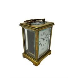 A Corniche cased 20th century timepiece carriage clock retailed by Mappin & Webb, with a white enamel dial , Roman numerals, spade hands and minute markers, four bevelled glass panels and a rectangular panel to the top, with a lever platform escapement, balance with timing screws.