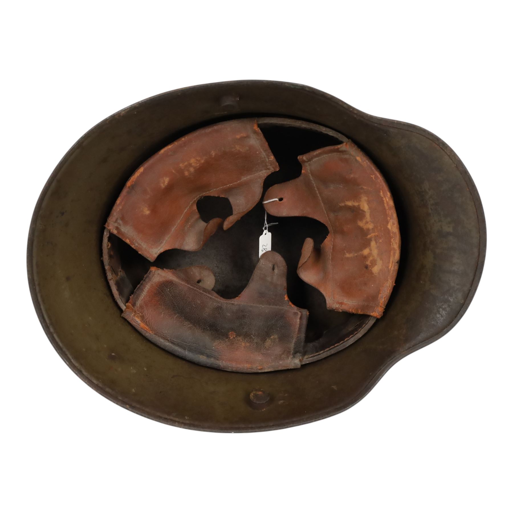 WWI German camouflage M16 helmet, with diamond camouflage painted finish to the skull in green, brown and ochre colours with black separation lines, the interior with leather band which supports three pad leather lining