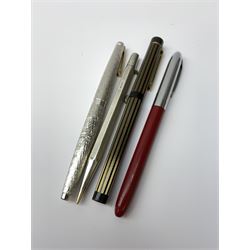 Three Sheaffer fountain pens, comprising a Lady Sheaffer fountain pen with bark effect decoration to body and nib marked 14K, an example with black and gold coloured vertical reeded body and nib marked 585 14K, and an example with burgundy resin body, chrome cap and nib marked 305, together with a silver Yard-O-Led propelling pencil with engine turned decoration to body, hallmarked E Baker & Son, Birmingham 1975.