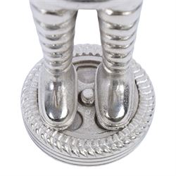 Metal hollow-cast figure, modelled as a Michelin Man stood upon a tire, H26.5cm