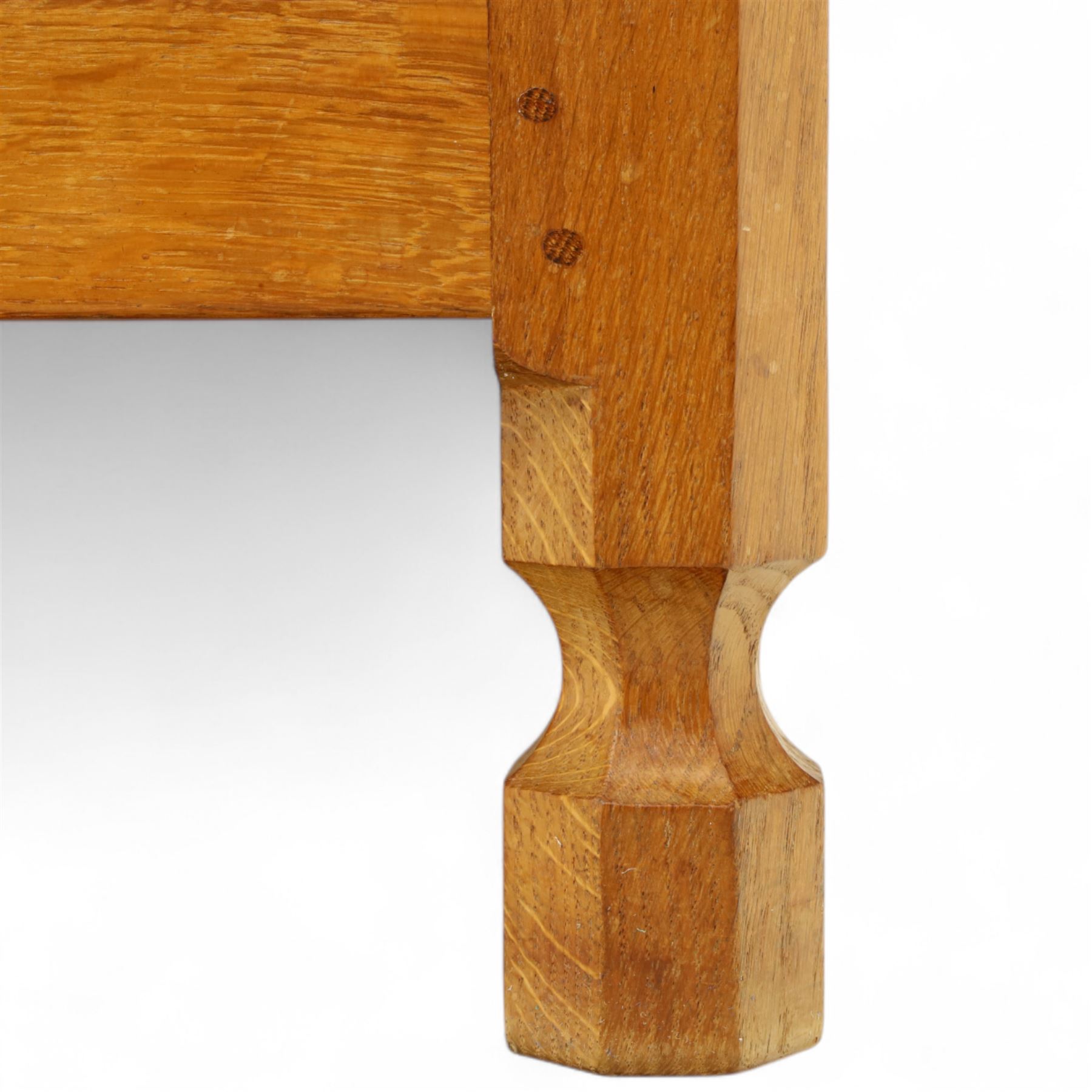 Mouseman - oak sideboard with adzed top and raised gallery back, over two short drawers and three long drawers, flanked by panelled cupboard doors with wrought iron fittings, on octagonal feet, carved with the signature mouse to the right-hand door