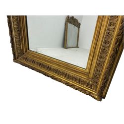 Victorian giltwood and gesso wall mirror, the rectangular frame decorated with bay leaf garland and repeating acanthus leaf motifs, moulded inner slips enclosing plain mirror plate 