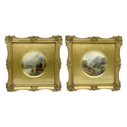 Pair of early 20th century Royal Worcester porcelain plaques painted by John Stinton Junior, each of circular form painted with highland cattle against mountainous landscapes, set within gilt frames with gilt mounts, each frame with circular cut out verso revealing puce printed marks to porcelain plaques with date code for 1919, overall H21.5cm W21.5cm plaques D10cm