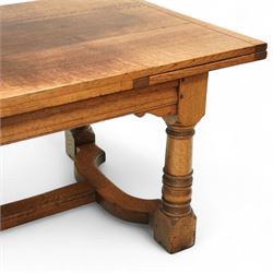 17th century design oak refectory extending dining table, the rectangular planked top with cleated ends, with two concealed leaves, raised on turned baluster supports united by shaped stretchers (Extends to 331cm)