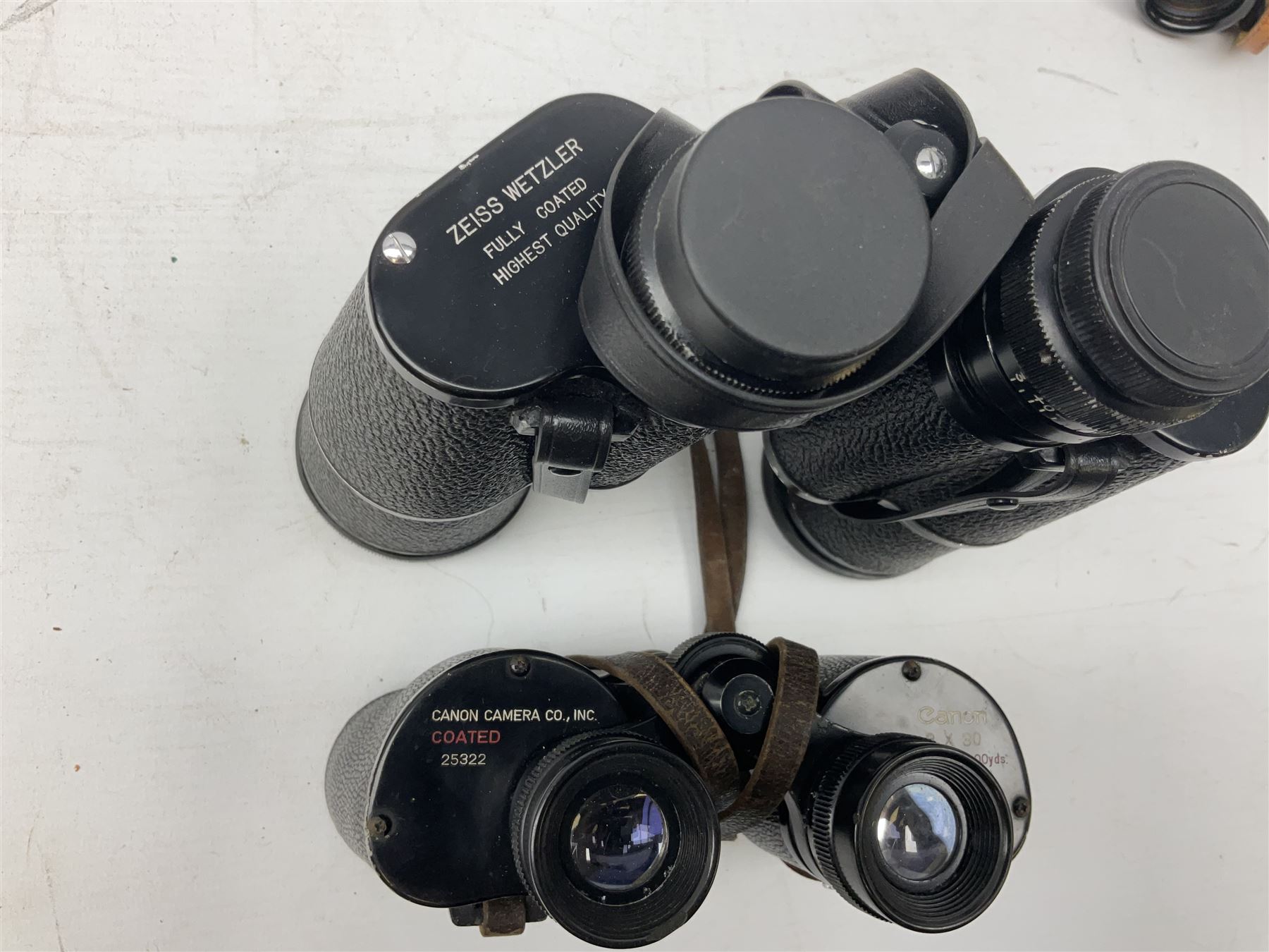 Eleven pairs of binoculars, to include Zeiss Wetzler 20x50, Taylor-Hobson Bino Prism No.2 Mk.III military stamped 1943 with broad arrow,  Swift Tecnar 16x50, J.T Coppock Oceanic Bloomed 10x50, Hensoldt Wetzlar Dialyt 7x42 etc