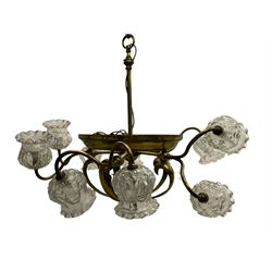 Mid-20th century brass lightolier or light fitting, the scrolling foliate branches connected with a central ring, terminating in ten tulip shaped cut glass sades, pointed terminal beneath