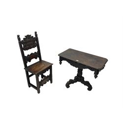 Late 19th century Gothic revival carved oak pedestal table, rectangular top with carved edges, apron carved with trailing foliate and scrolled decoration, heavily detailed column with scrolling decoration and floral carvings, the tripod base with cabriole supports carved with flowerheads (93cm x 53cm x 75cm; Late 19th century carved oak hall chair, panelled back rails with extending scroll decoration (51cm x 40cm x 116cm)