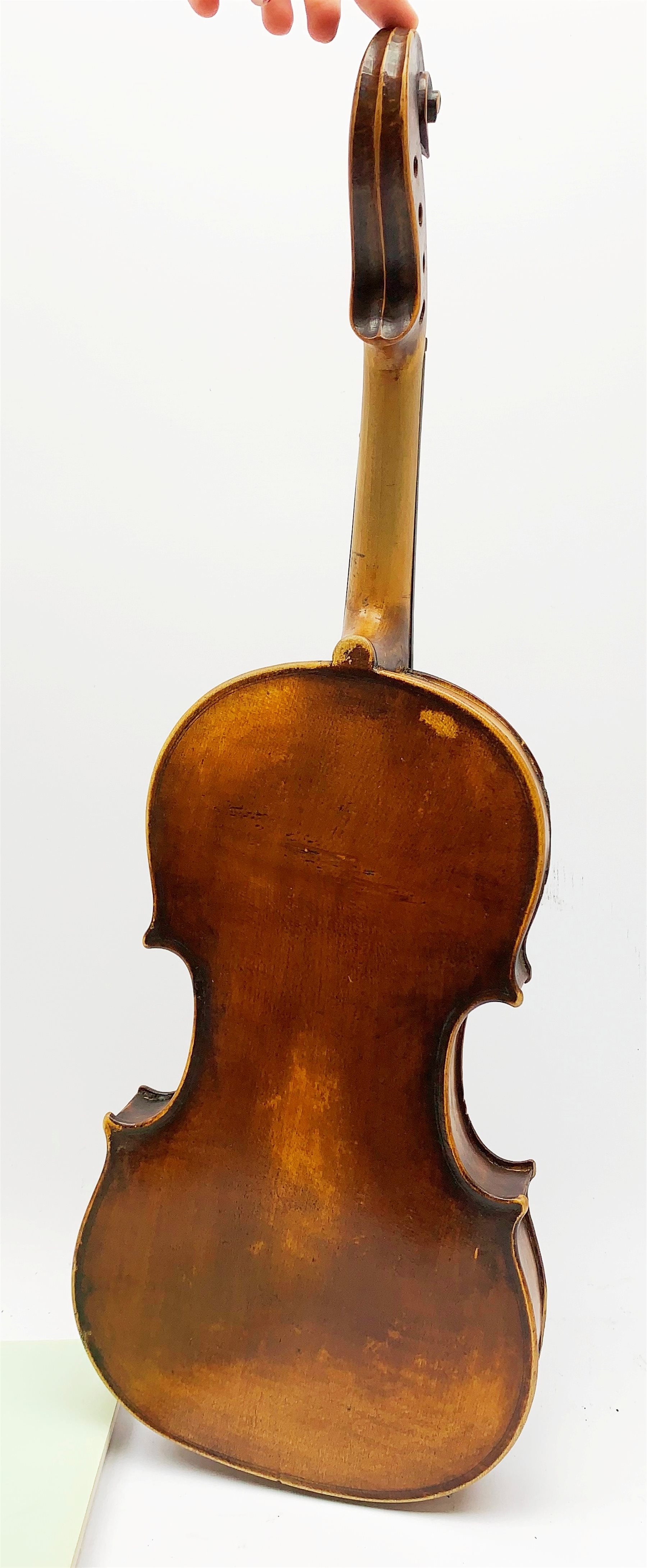  Late 19th century German violin for completion with 36cm one-piece maple back and ribs and spruce top, bears label Copie De Albani Palermo 1633, 59cm overall together with three books on violin construction, restoration and varnishing  
