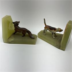 A pair of Art Deco onyx bookends, surmounted with spelter figures modelled as a hound and fox, each H9cm L12cm.