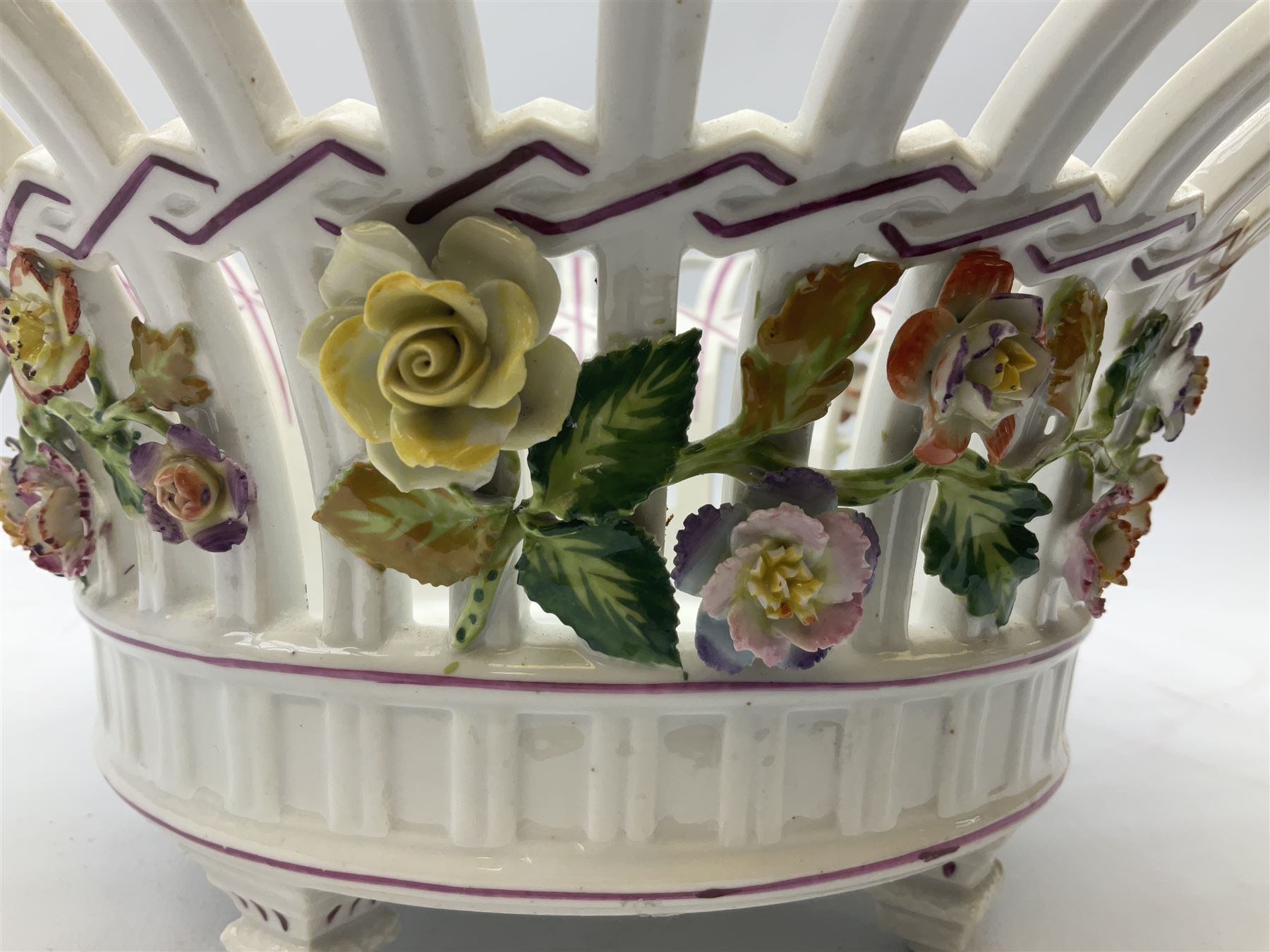 Early 20th century Dresden floral encrusted pierced bowl, centrally painted with flowers, on four tapering supports, D30cm 
