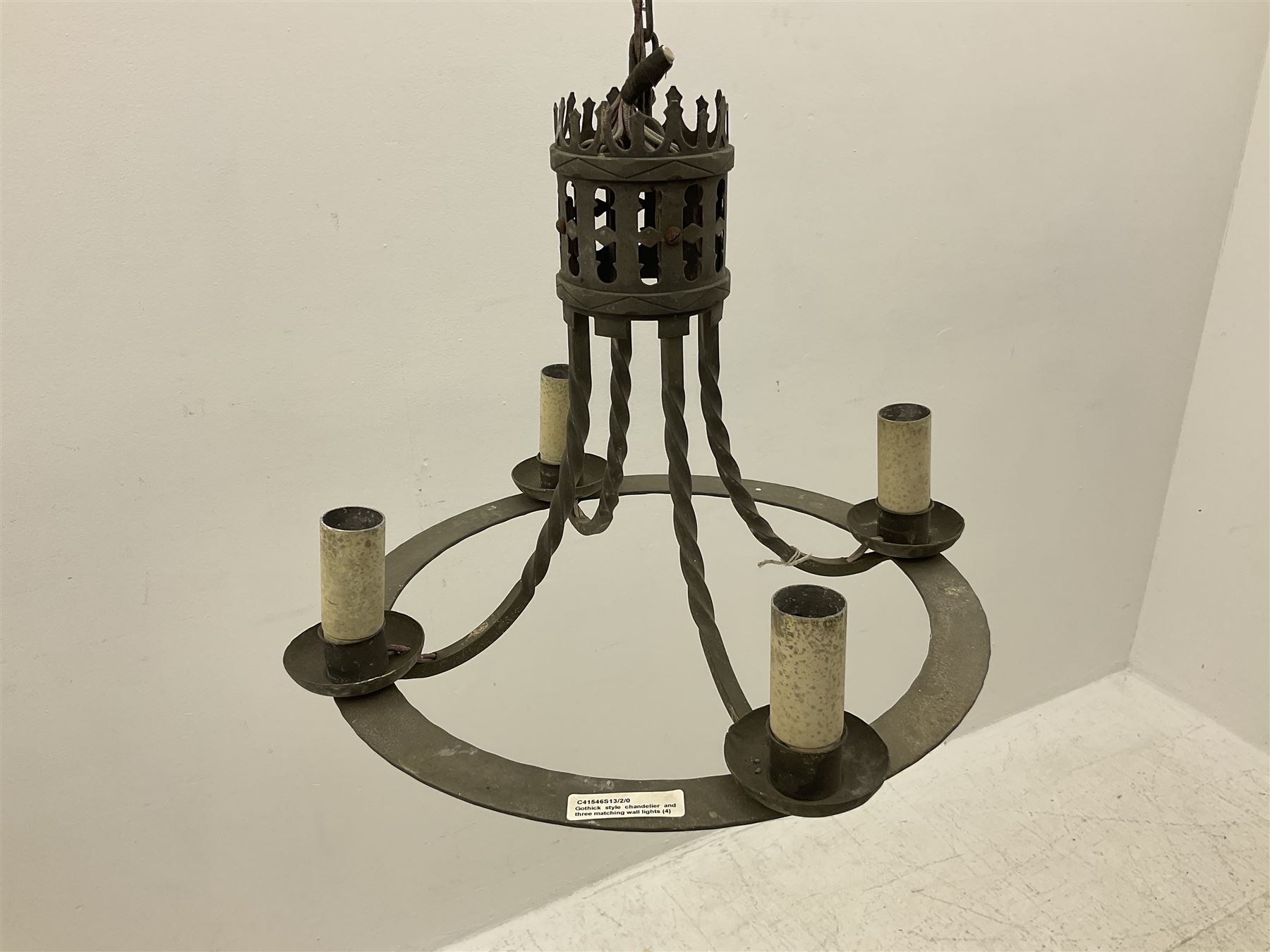 Gothic style iron chandelier with drip pans and twisted branches together with three matching twin wall sconces