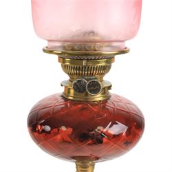 Victorian oil lamp, with etched shade with fluted rim, above a cranberry reservoir, on twisted brass pedestal and decorative base, together with cranberry glass jar, lamp H72cm 