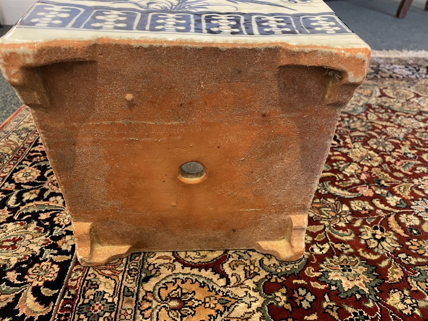 Chinese blue and white planter and stand, each of square slightly tapering and flared form, the planter decorated with two dragons and blossoming peonies, between stylised borders, the stand decorated with flower heads and vines, planter H30cm W29cm, stand H7cm D28.5cm