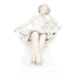 Royal Copenhagen figure no. 894, Woman Seated in a Chair, designed by Axel Locher, H20cm