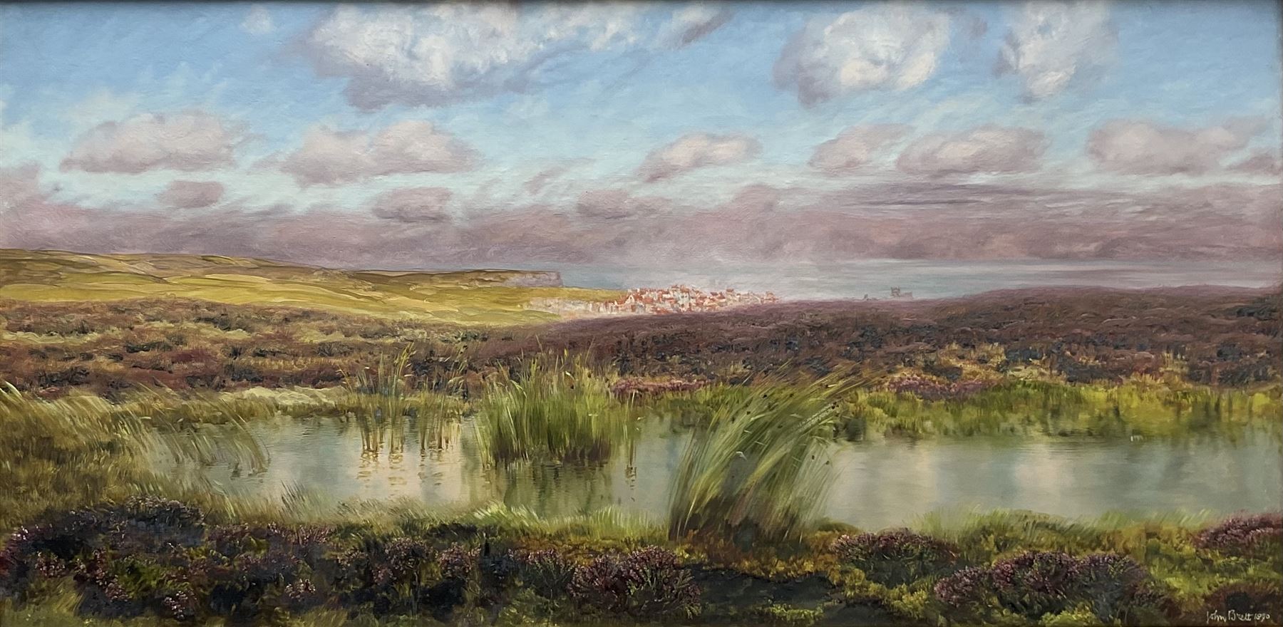 John Brett (British 1831-1902): 'Fylingdales Moor' looking towards Whitby, oil on canvas signed and dated 1890, 38cm x 76cm
Provenance: East Yorkshire private collection; exh. Royal Academy 1891 No.458; purchased by W.A. Pye Esq. in February 1891 for the sum of £100, then by descent through the Pye family; Sotheby's London 12th November 1992, Lot 132; Thomas Agnew & Sons Ltd. London (then listed as Treyarnon Bay) No.WA2457 (label verso) where purchased by J.E. Dayton; Sotheby's London 10th March 2005, Lot 217, where purchased by the vendor (at the same sale an oil sketch of the same scene was sold as Lot 218).
Literature: Birmingham Daily Post 30th May 1891; C. Payne & C. Brett: John Brett: Pre-Raphaelite Landscape Painter (Yale Univ. Press 2010) Cat no.1350, ill p 236
Notes: The painting has previously been erroneously listed as Treyarnon Bay; this is because the frame, made for the artist by Dolman & Son, previously contained 'Treyarnon Bay' of 1889, and a label previously affixed to the frame displayed this title.