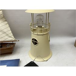 Nautical themed decorative items, to include Titanic book ends, model boat, books, lighthouse lamp etc in one box