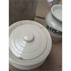 19th century sage green apothecary jars with gilt labels, four white ceramic kitchen jars and a stoneware flaggon marked Wheat Wine