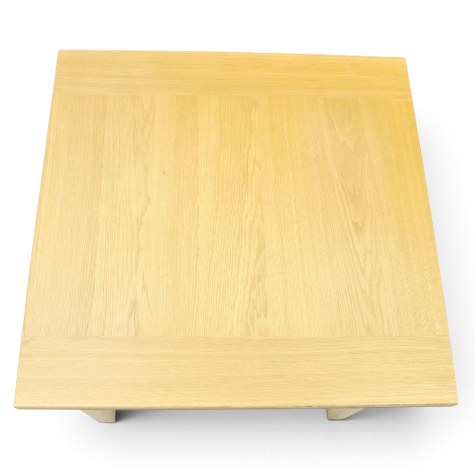 Contemporary light oak extending dining table, the square top with pull-out and fold-over action, raised on square supports