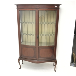 Edwardian inlaid mahogany bow front display cabinet, projecting cornice, two lead glazed doors enclosing two shelves, cabriole legs, W109cm, H175cm, D41cm