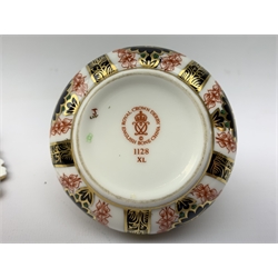  A Crown Derby Imari 1128 pattern dish, of oval form with foliate modelled twin handles, and raised upon four stylised feet, L29.5cm, together with a Crown Derby Imari table cigarette lighter, each with printed mark to base.   