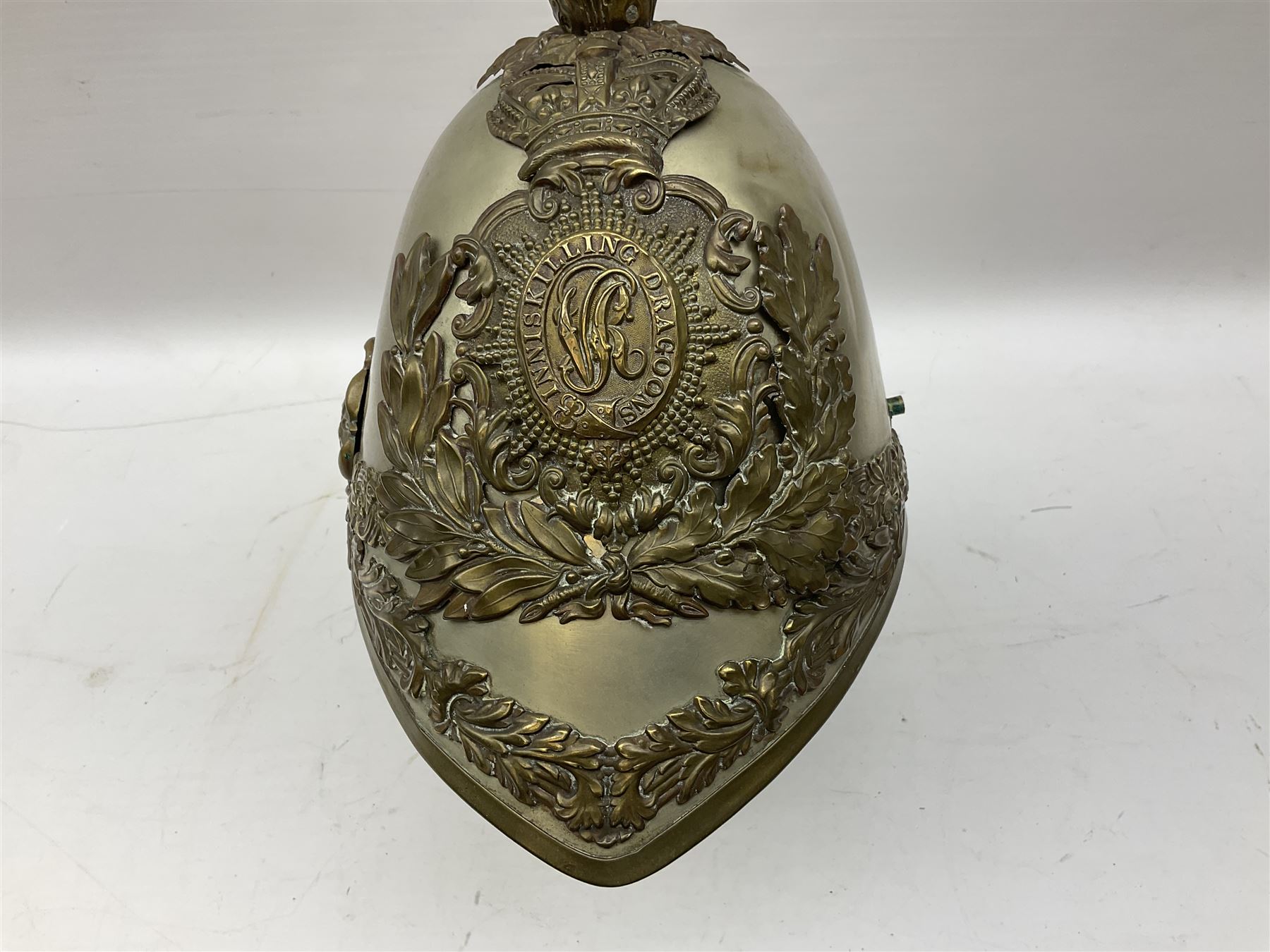 Victorian 1847 Pattern Officer's Helmet of the Inniskilling Dragoons, the white metal skull with gilt fittings including VR cypher to the plate; with leather liner H24cm