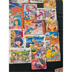 Collection of Pokemon TGC trading cards, including two WB First Movie Black Star promo cards Pikachu no. 4 and Dragonite no. 5, two Ancient Mew Black Star holo promo cards, Gym Challenge Giovanni's Persian 8/132 holo and a small collection WOTC, Neo Discovery and Neo Genesis cards, together with thirty four Bandai Carddass Pokemon cards, including prism Charizard no. 186 and Pokemon Topps cards including holo examples 