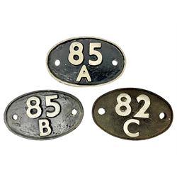 One cast iron and two metal carriage number plates, each of oval form, detailed 85A, 85B and 82C