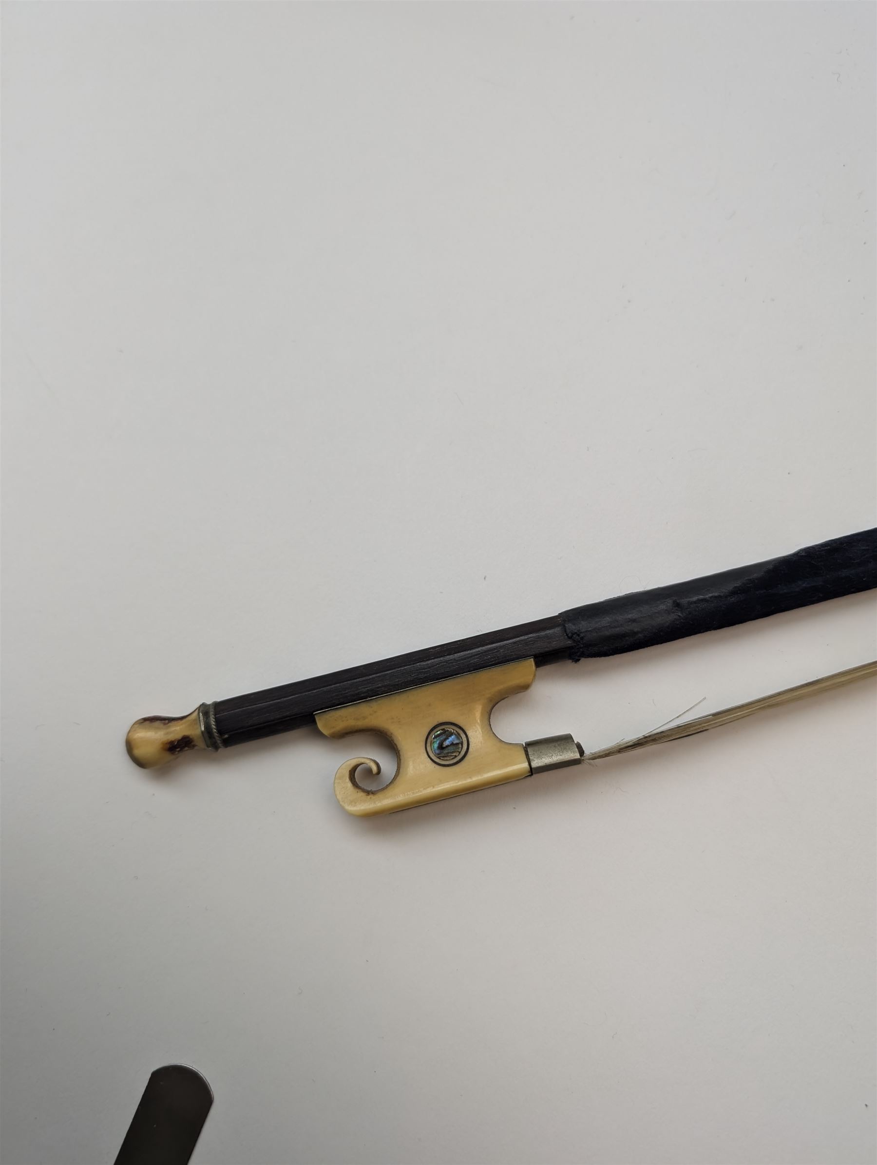 Late 19th century full size German violin with a  Wolff Brothers label, scroll with ebony pegs, finger board and tail piece, in a hard case with bow. Length 60cm

This item has been registered for sale under Section 10 of the APHA Ivory Act