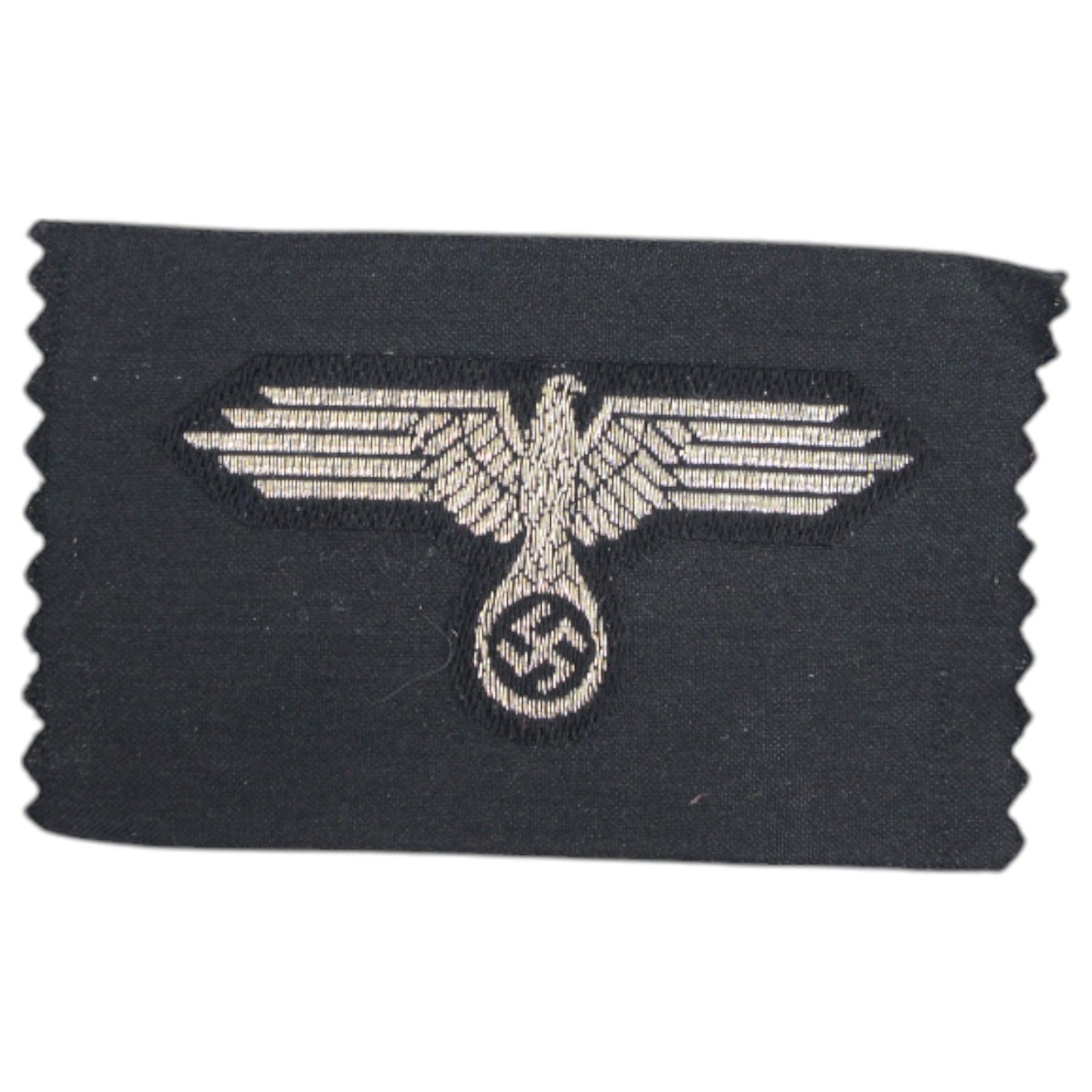 Third Reich SS officers cap insignia, machine-woven silver bullion SS Eagle, on black rectangle, together with German Eastern Front Medal, insignia H5cm, L7cm 