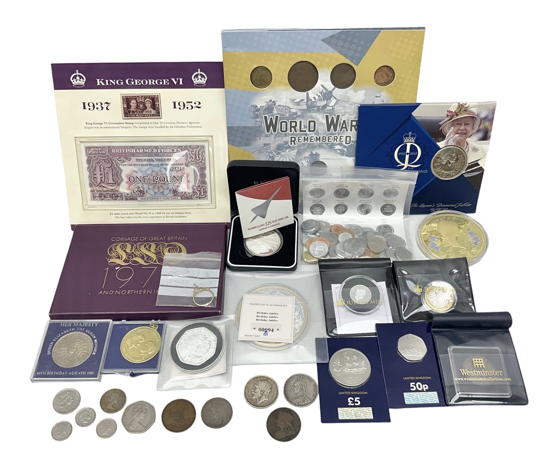 Coins and sets, including Great Britain and Northern Ireland 1970 proof coin collection in card folder, Queen Elizabeth II 2021 'Through the Looking Glass' five pounds, 2021 'Winnie the Pooh' fifty pence, Queen Victoria 1887 halfcrown, King George V 1914 halfcrown, commemorative coins, The Royal Mint Solomon Islands 2003 twenty-five dollars silver proof coin cased with certificate, 9ct gold half sovereign mount etc