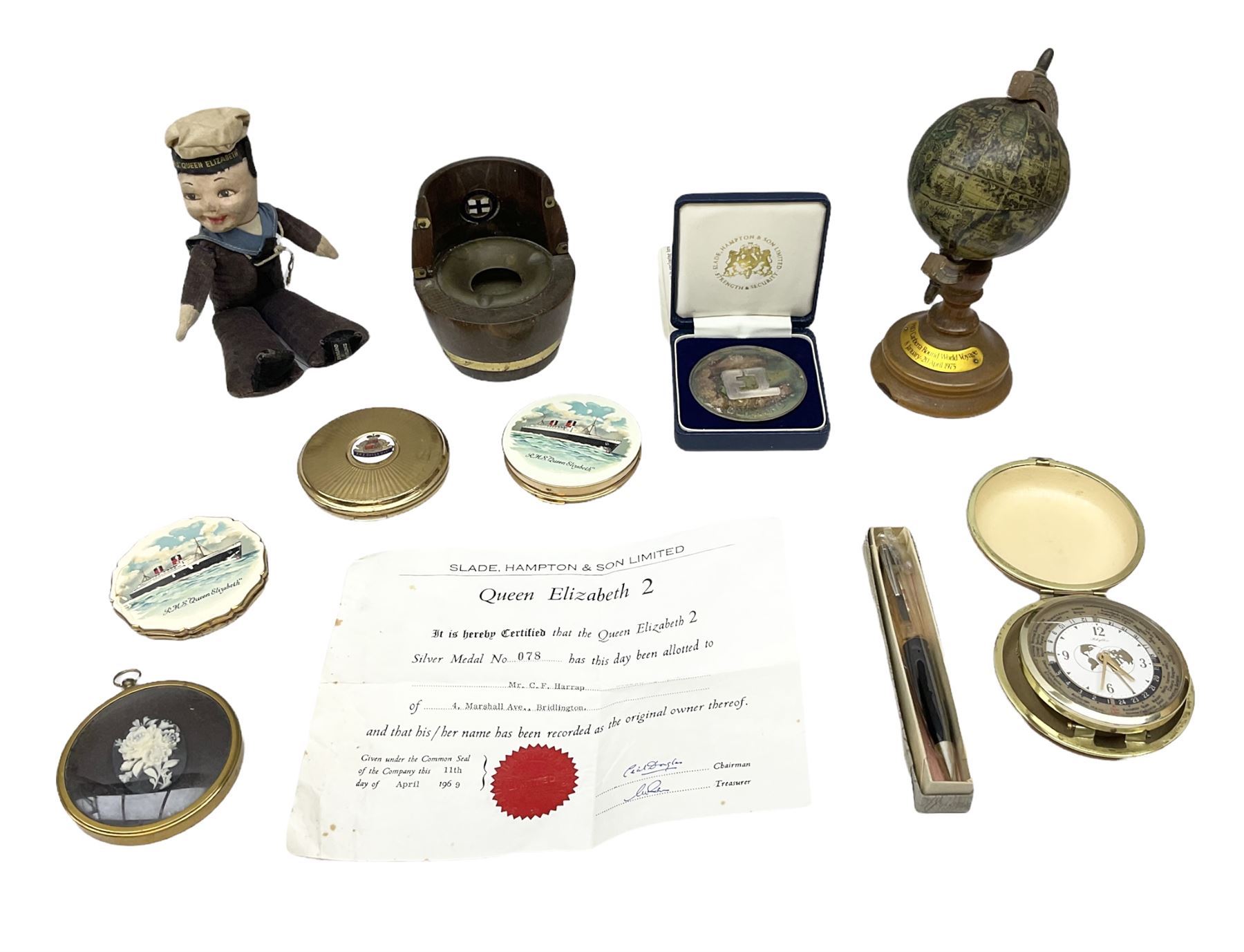Silver 1969 Cunard RMS Queen Elizabeth maiden voyage commemorative medallion, in original Slade, Hampton & Son case with certificate, two Stratton R.M.S Queen Elizabeth mirror compacts, Stratton R.M.S Queen Mary compact, mid 20th century P&O Canberra Round World Voyage miniature globe, S.S Oriana ash tray modelled as a barrel, Norah Wellings sailor doll, and other maritime and shipping memorabilia 