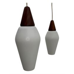 1970's Scandinavian teak three light centre light fitting, with white frosted tapered glass shades, in the style of designer Osten & Uno Kristiansson