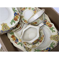Minton Marlow pattern tea and dinner wares, including dinner plates, side plates, tea cups, cake plate, etc together with Bishops & Stonier 'Bisto' green and gilt tea wares and Maddock Ivory Ware dinner wares, in three boxes