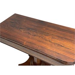 Early Victorian rosewood card table, rectangular swivel and fold-over top with rounded corners, baize lined interior, tapered octagonal column on concaved rectangular platform, on four turned feet 