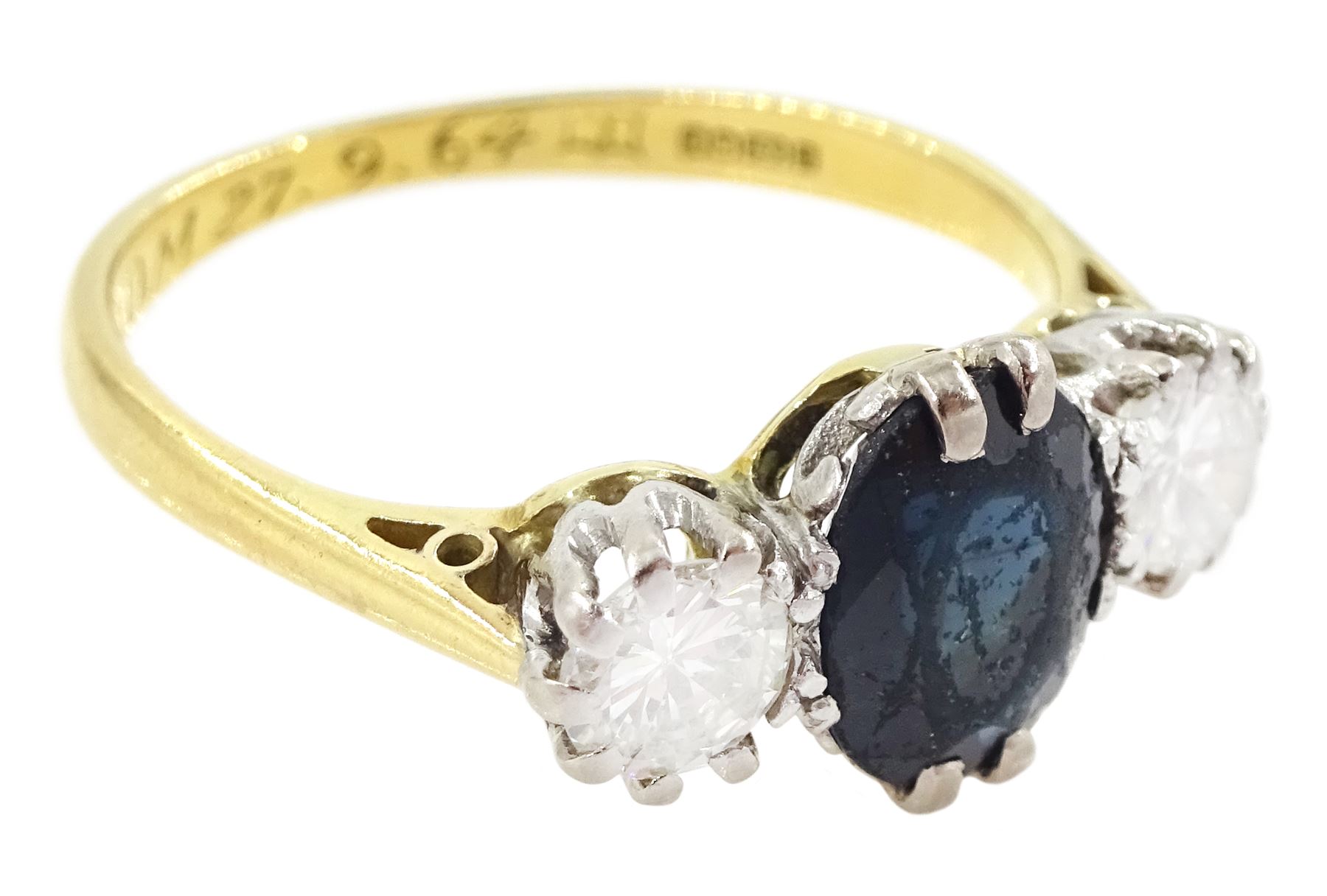 18ct gold sapphire and diamond three stone ring, single oval cut sapphire, with two round brilliant cut diamonds set either side, Sheffield 1987, total diamond weight approx 0.60 carat