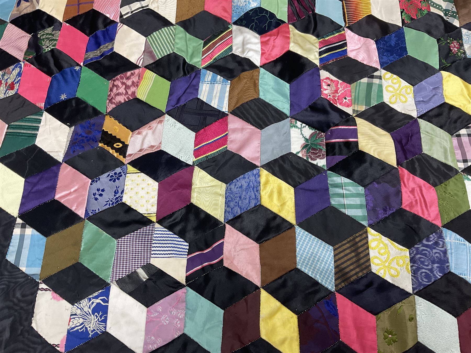 19th Century silk and satin tumbling blocks pattern patchwork quilt with black border 228cm X 196cm
