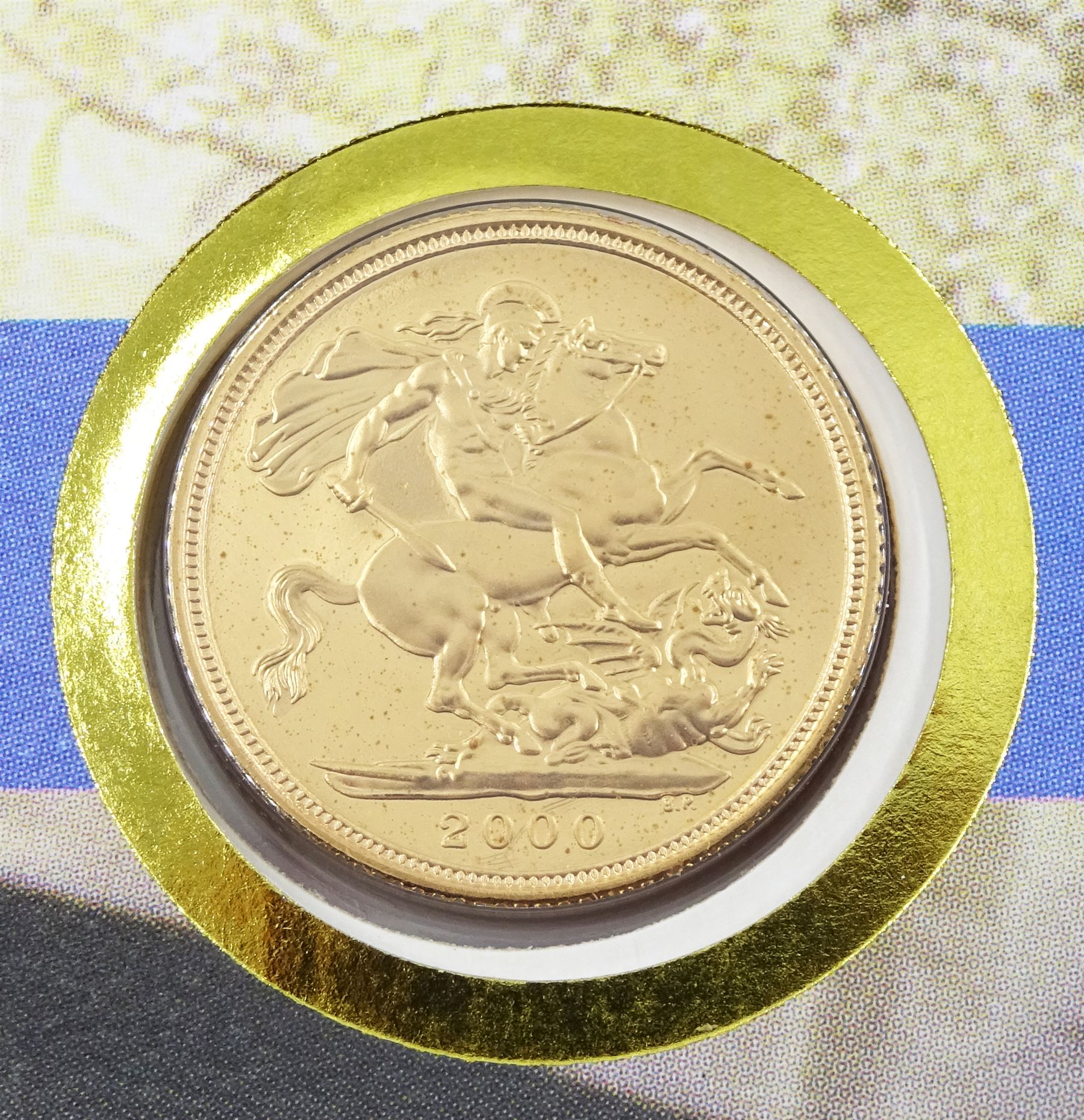 Queen Elizabeth II 2000 gold full sovereign coin, housed in a commemorative cover