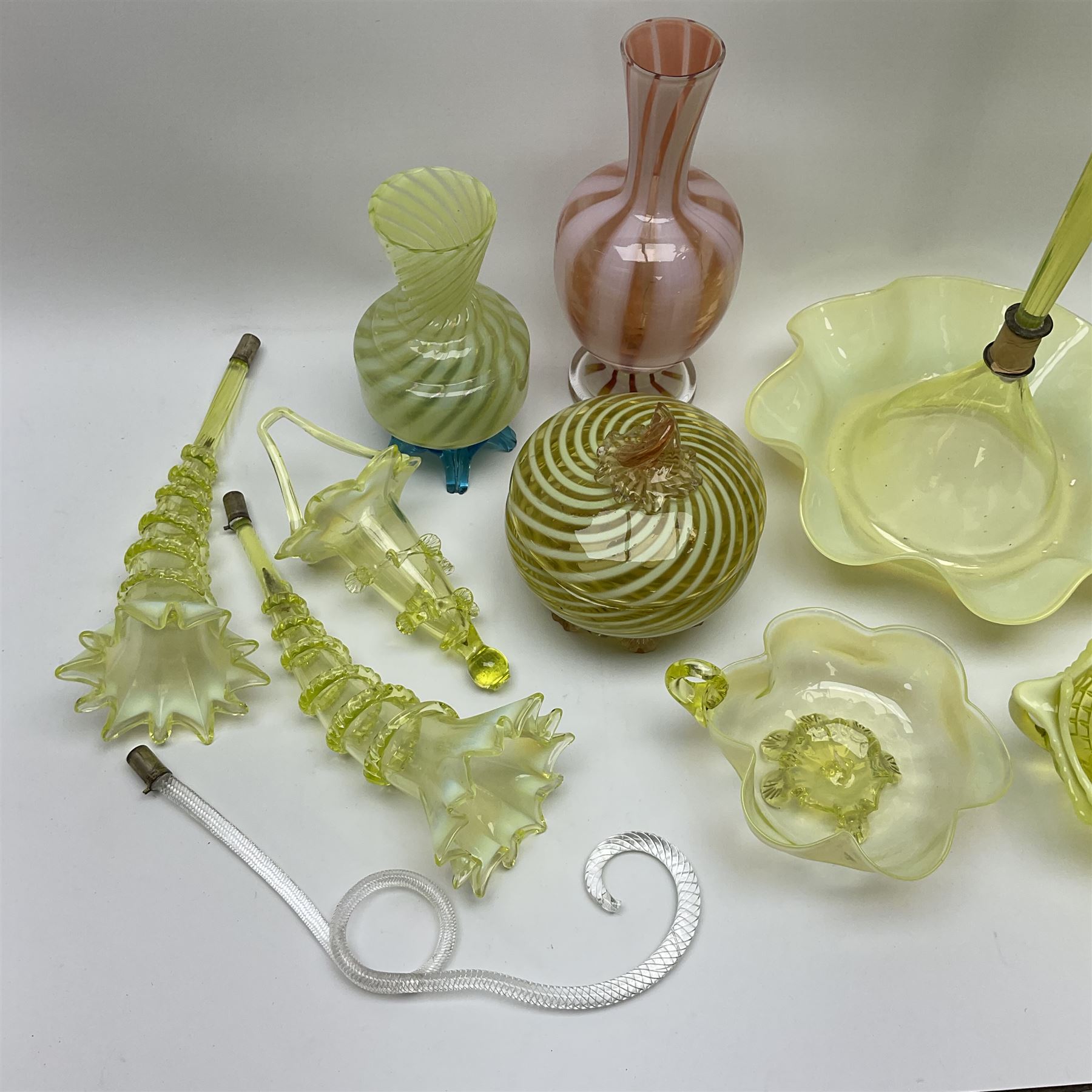 A group of Victorian and later Vaseline glass, to include part epergne, two vases with crimped rims and trailed decoration, a uranium glass vase, lemon Vaseline glass twin handled bowl, etc. 
