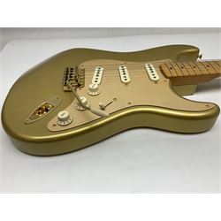 Fender Stratocaster 50th Anniversary 2004 metallic gold electric guitar; serial no.MZ4116369; L98cm; in Spider fitted case with owners manual and other paperwork, strap and belt buckle etc
