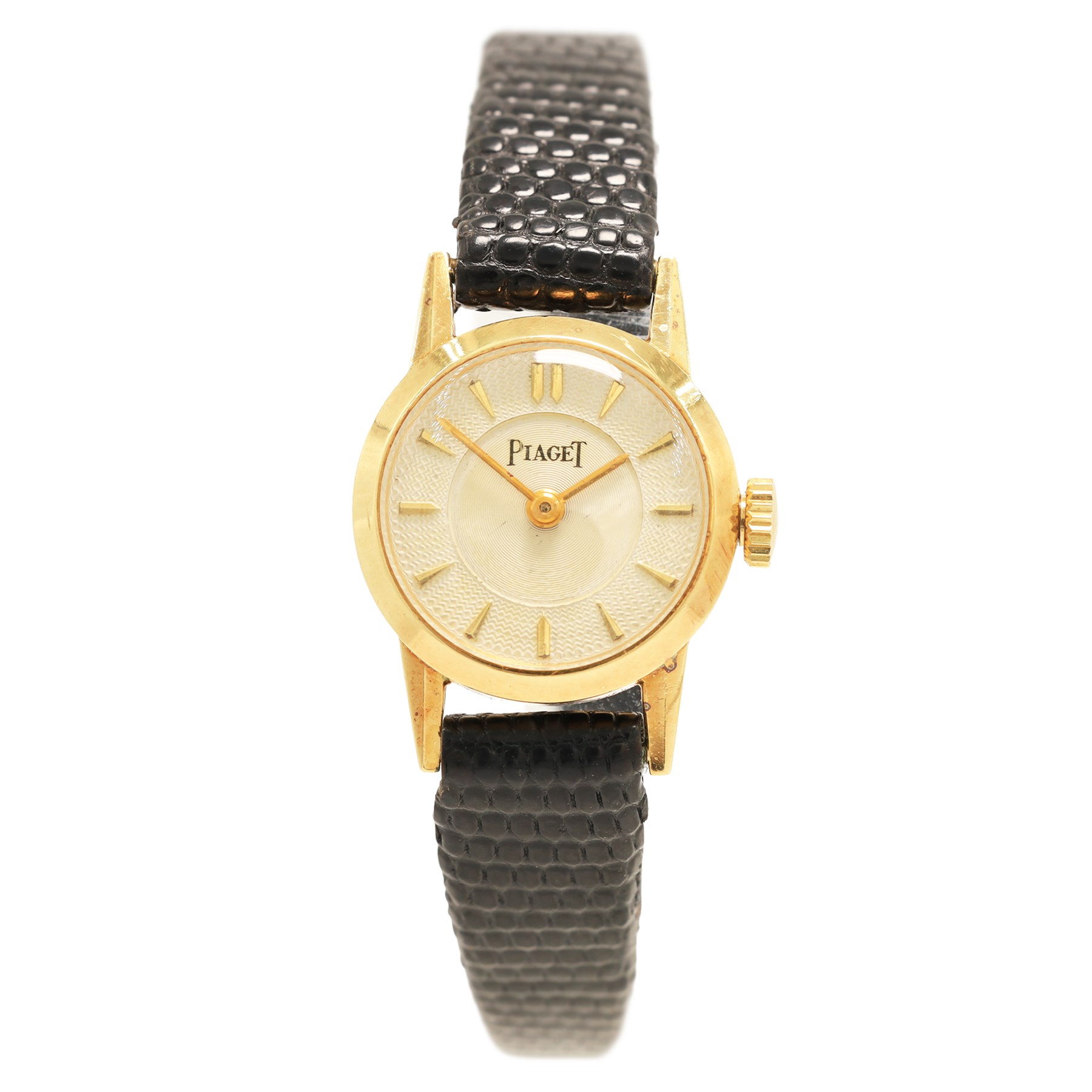 Piaget ladies 18ct gold manual wind wristwatch, silvered / champagne engine turned dial with dagger hour markers, back case No. 5635, Birmingham import mark 1956 with Helvetia hallmark, on black leather strap