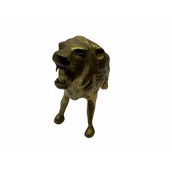 Large brass figure of a lion H29cm, together with a brass swan, and brass giraffe on wooden plinth H74cm. 