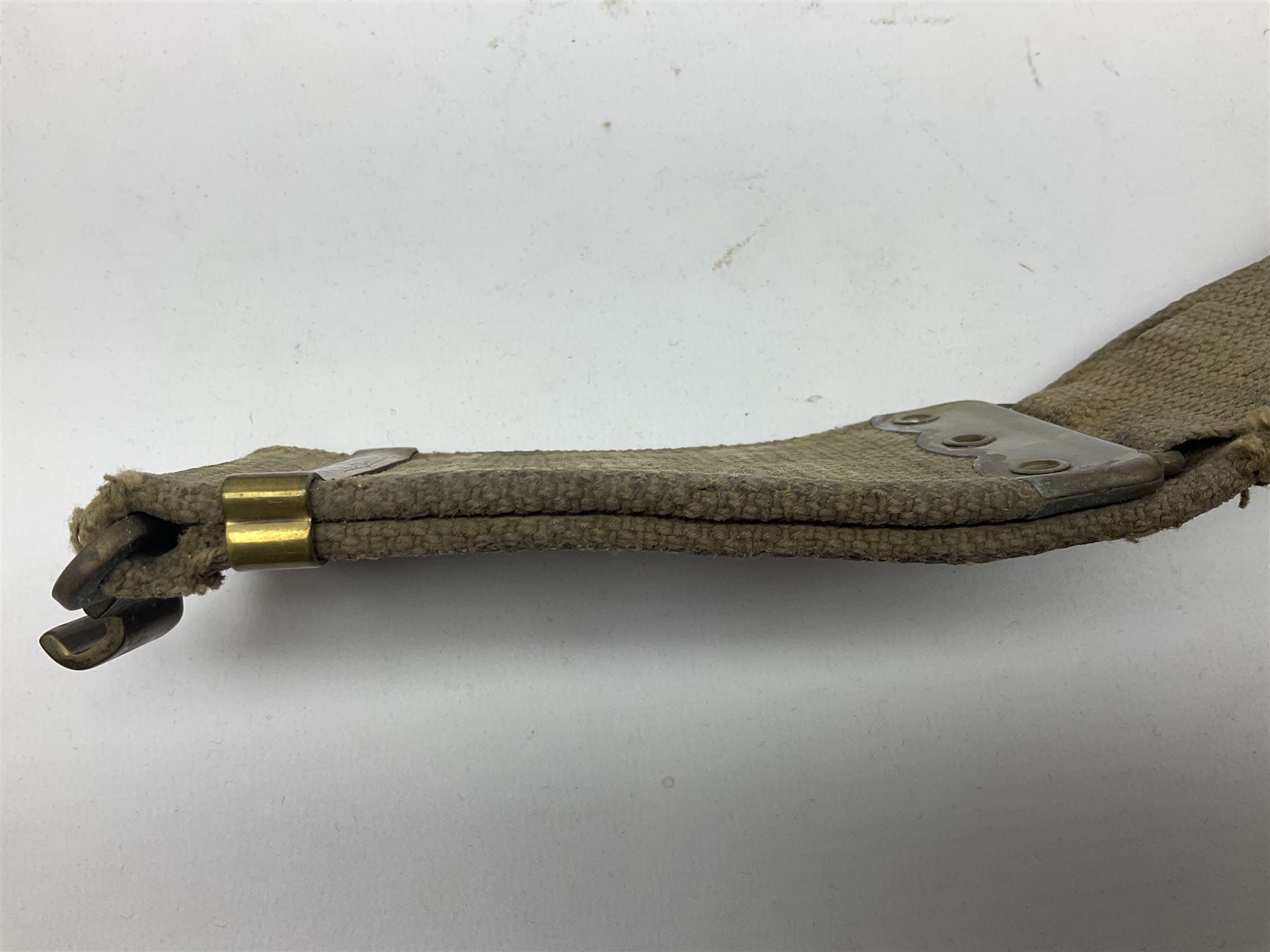 WW2 British black felt beret with Pioneer Corps cap badge, with Kangol Wear maker's mark dated 1943; and a British Army green webbing belt (2)