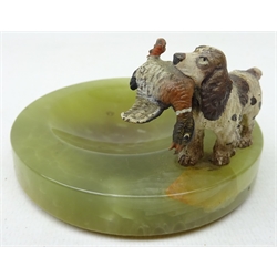  Green onyx circular ashtray mounted with a cold painted bronze figure of a gun dog carrying game D9cm  