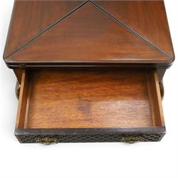 Edwardian carved mahogany envelope card table, the rectangular quadruple hinged top enclosing baize-lined interior, the single frieze drawer and sides with blind-fretwork carving, over cabriole supports with scroll feet and castors united by pierced lattice fretwork X-stretcher with turned finial