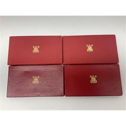 Four King George VI 1950 specimen coin sets, each comprising farthing, half penny, penny, threepence, sixpence, English  one shilling, Scottish one shilling, two shillings and half crown, each in red Royal Mint card case