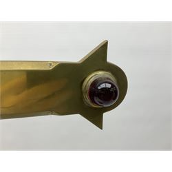 Brass alter cross, decorated with glass cabochons, upon a acicular stepped base and three claw feet, H73cm 